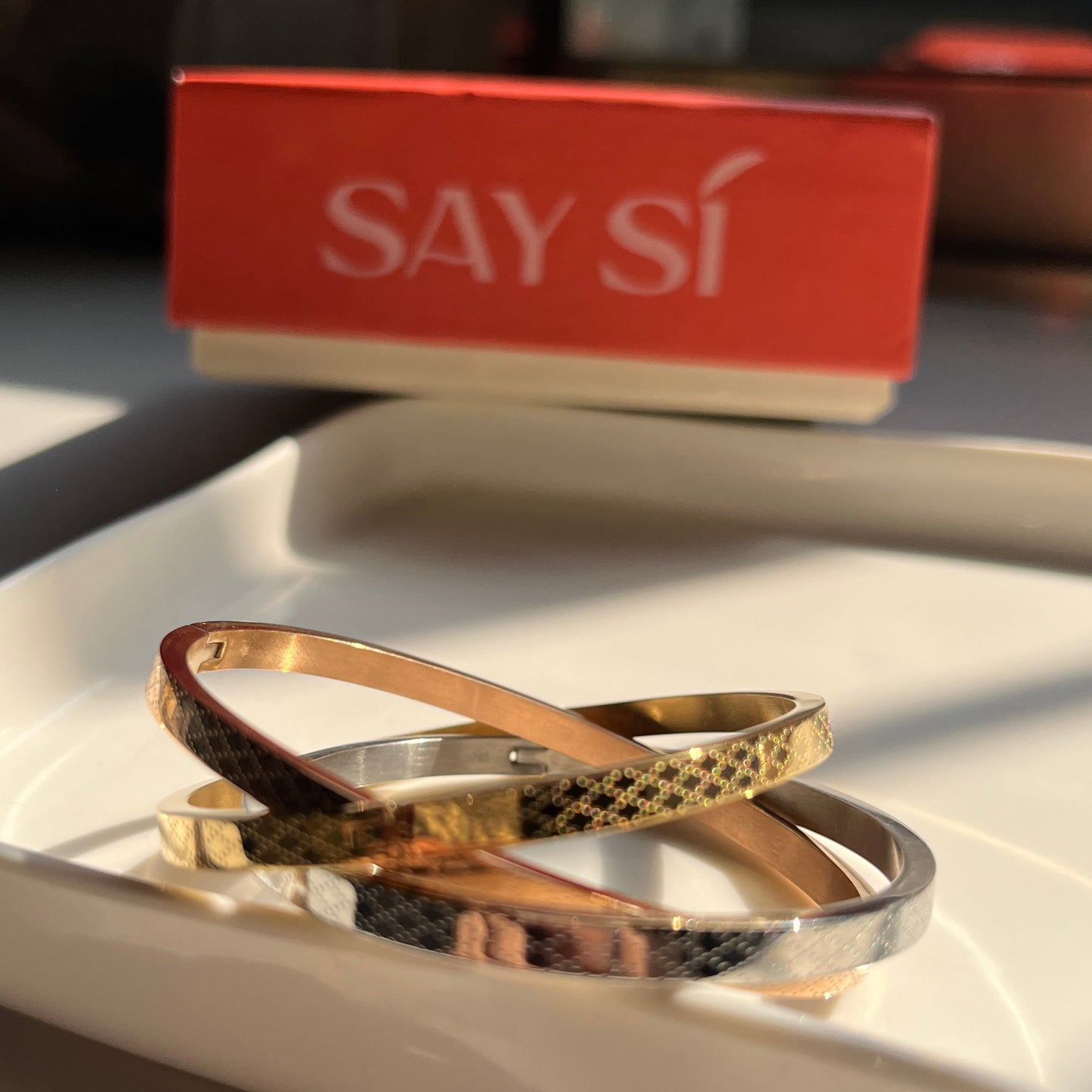 Three bangles - rose gold, gold and silver with a Say Si Box