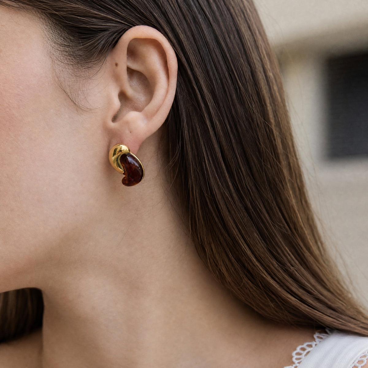 Front and side views of Alba Brown sculptural stud earrings