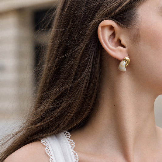 Front and side views of Alba Cream and gold-tone stud earrings