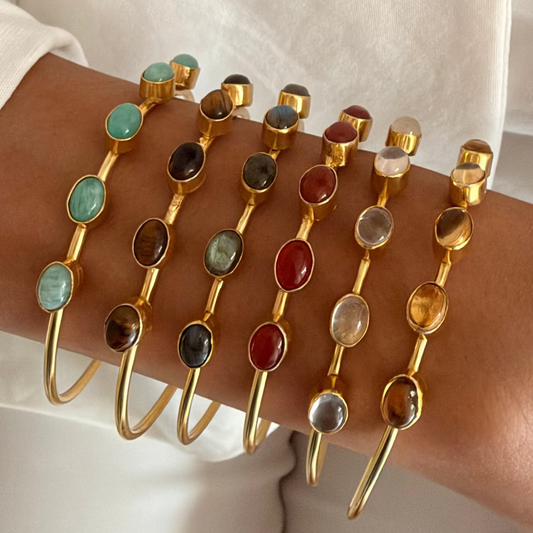 Casaata brass cuff bangle with  oval natural stones and a high-gold finish