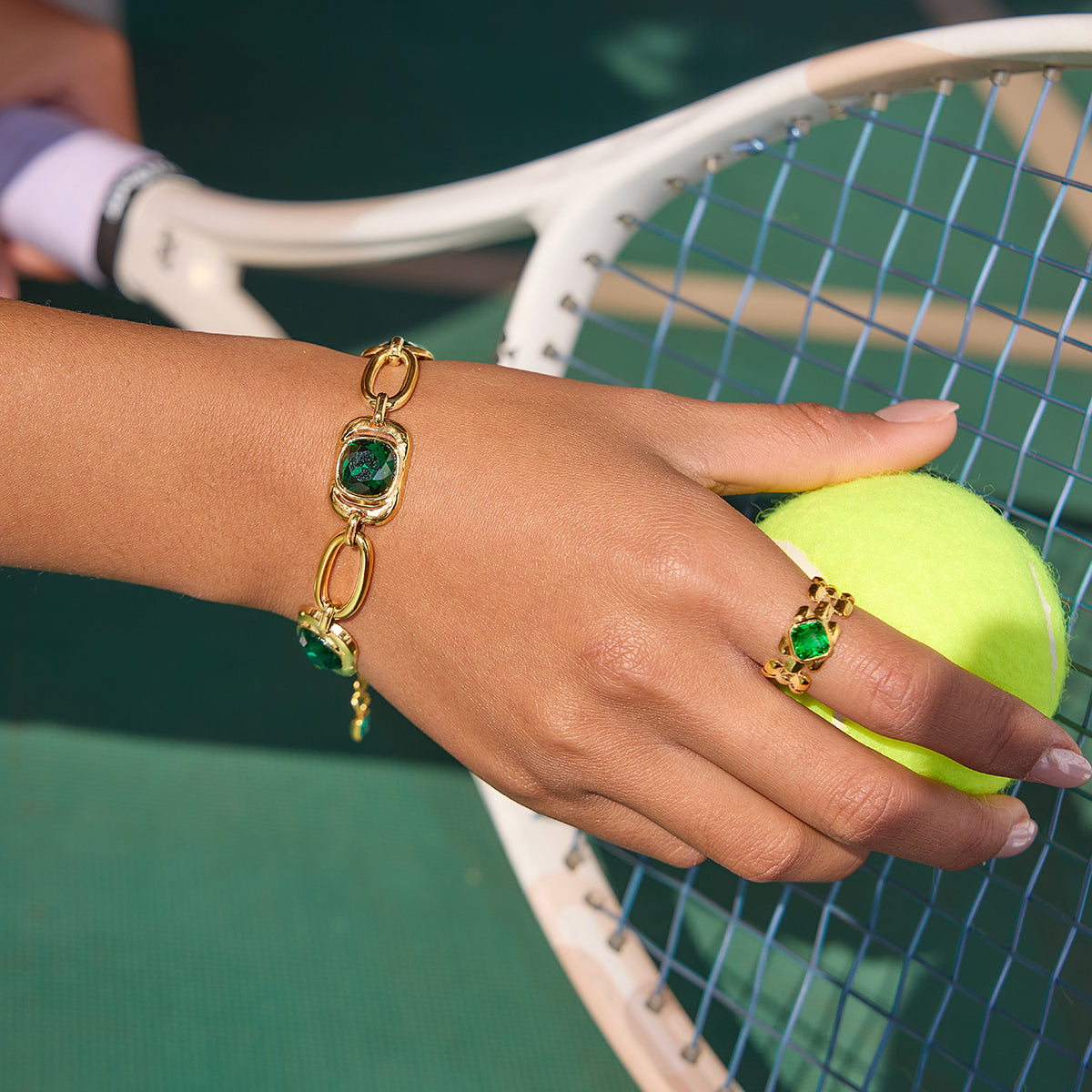 Emerald Hour Chain Link Bracelet on a model playing tennis