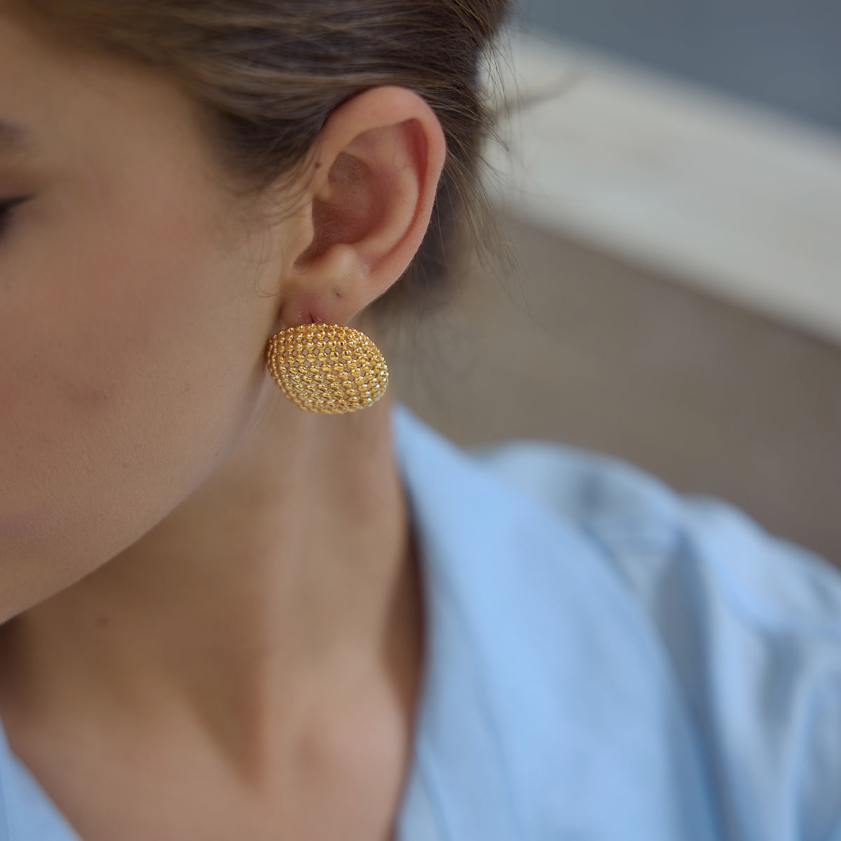 Honeycomb statement studs on a model