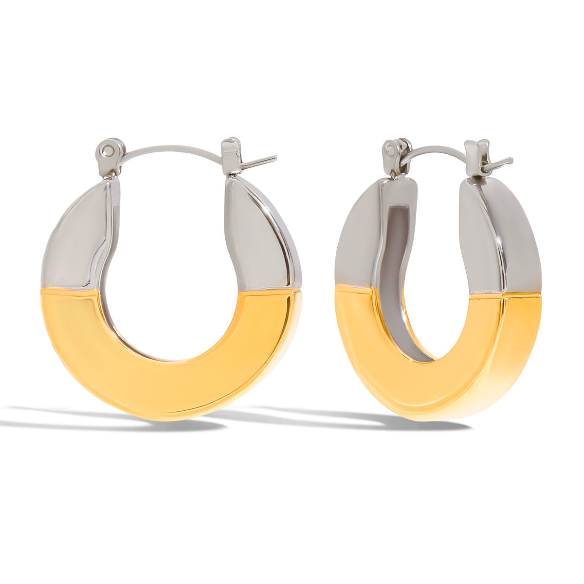 Pair of hoop earrings with gold and silver design on a white background