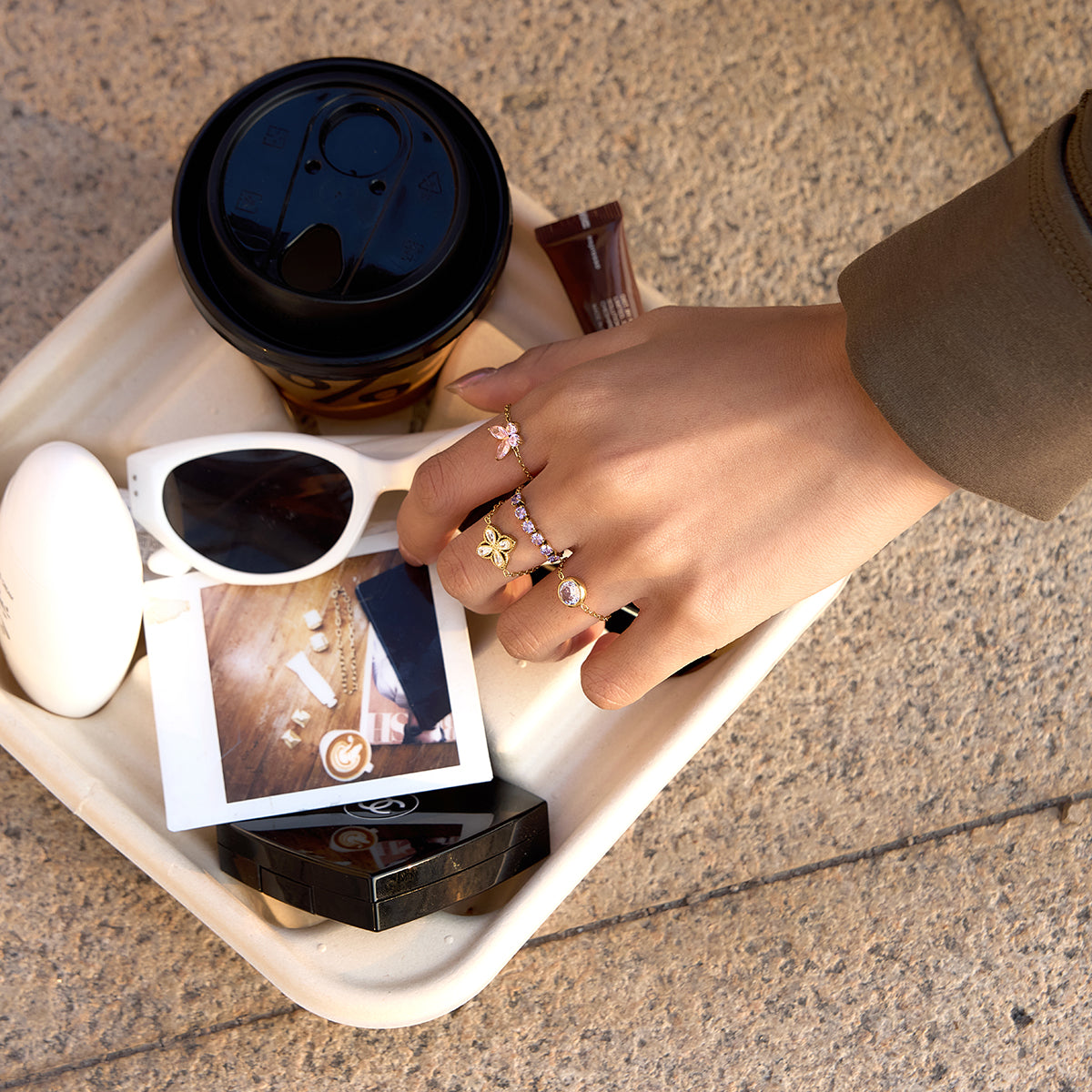 A lifestyle shot of a model wearing different pull me rings