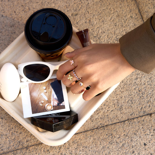 A lifestyle shot of a model wearing different pull me rings