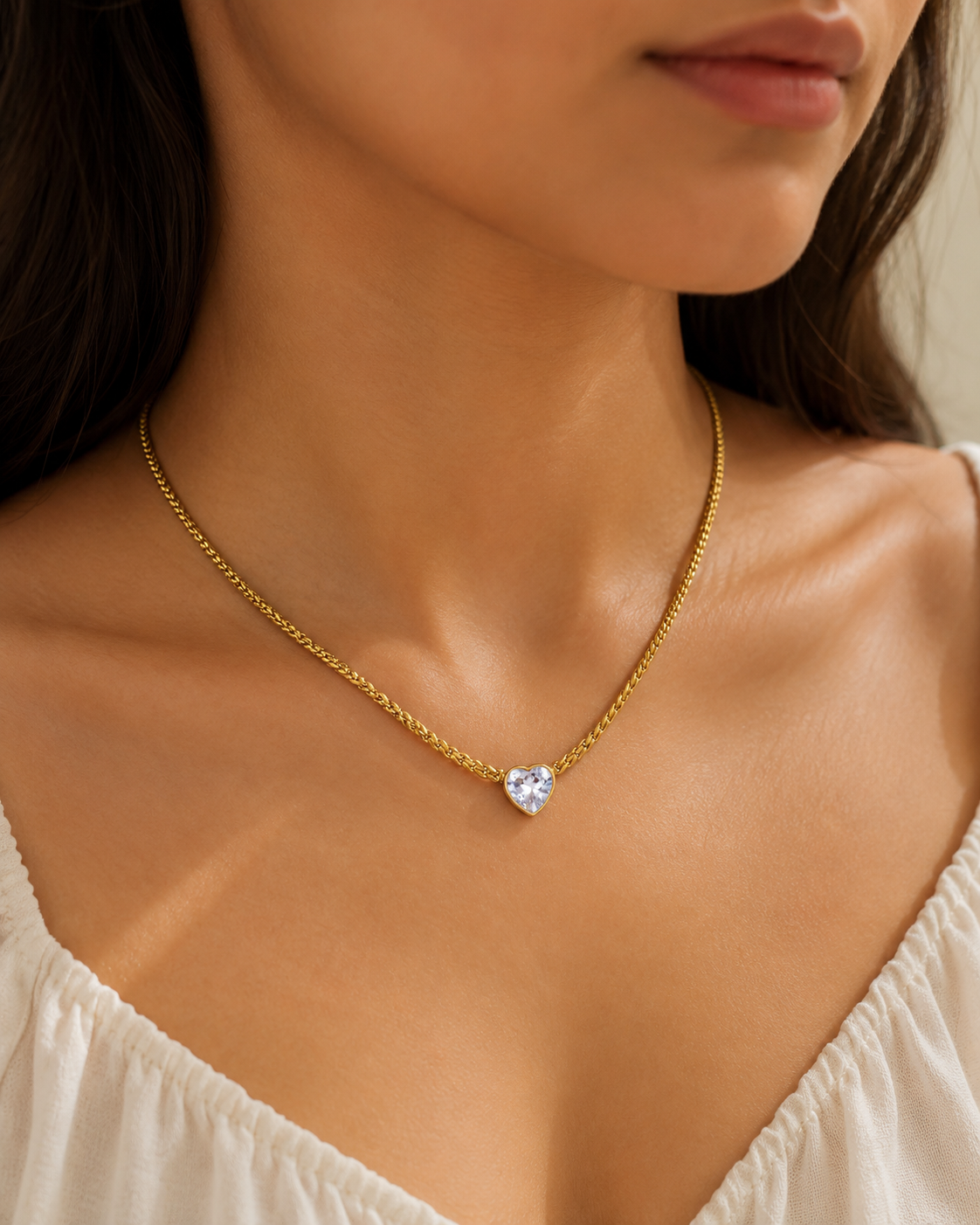 Girl wearing the Sweetheart Drop Necklace with a white top