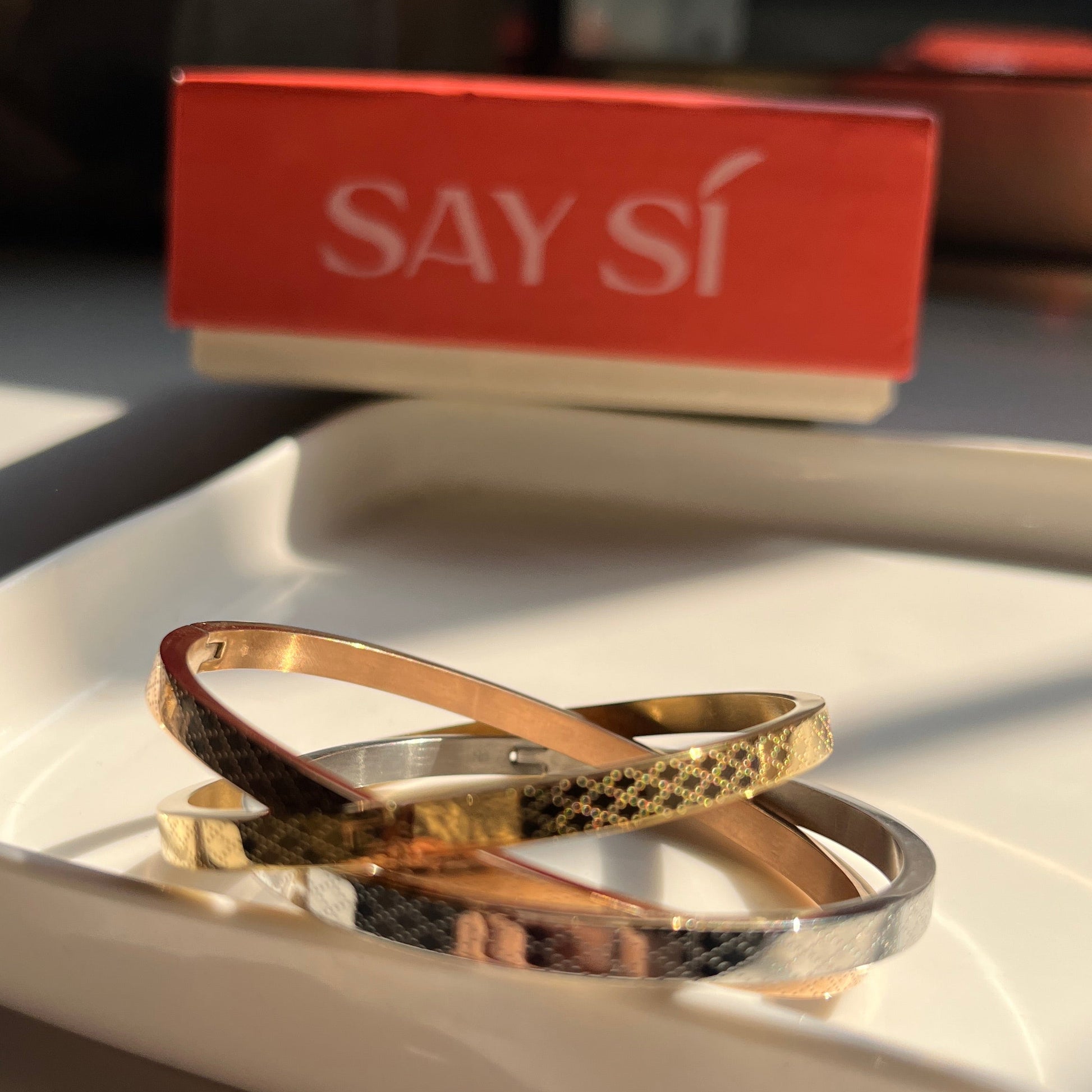 Three bangles - rose gold, gold and silver with a Say Si Box