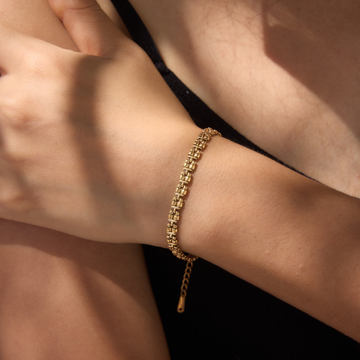 A girl wearing our gold Zari Bracelet