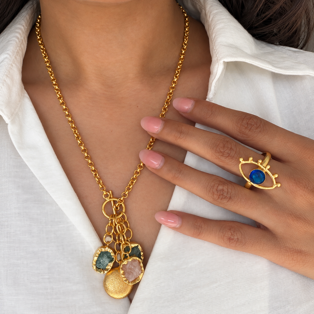 Close-up of the Latkan Stone Necklace resting against the neckline of a white shirt