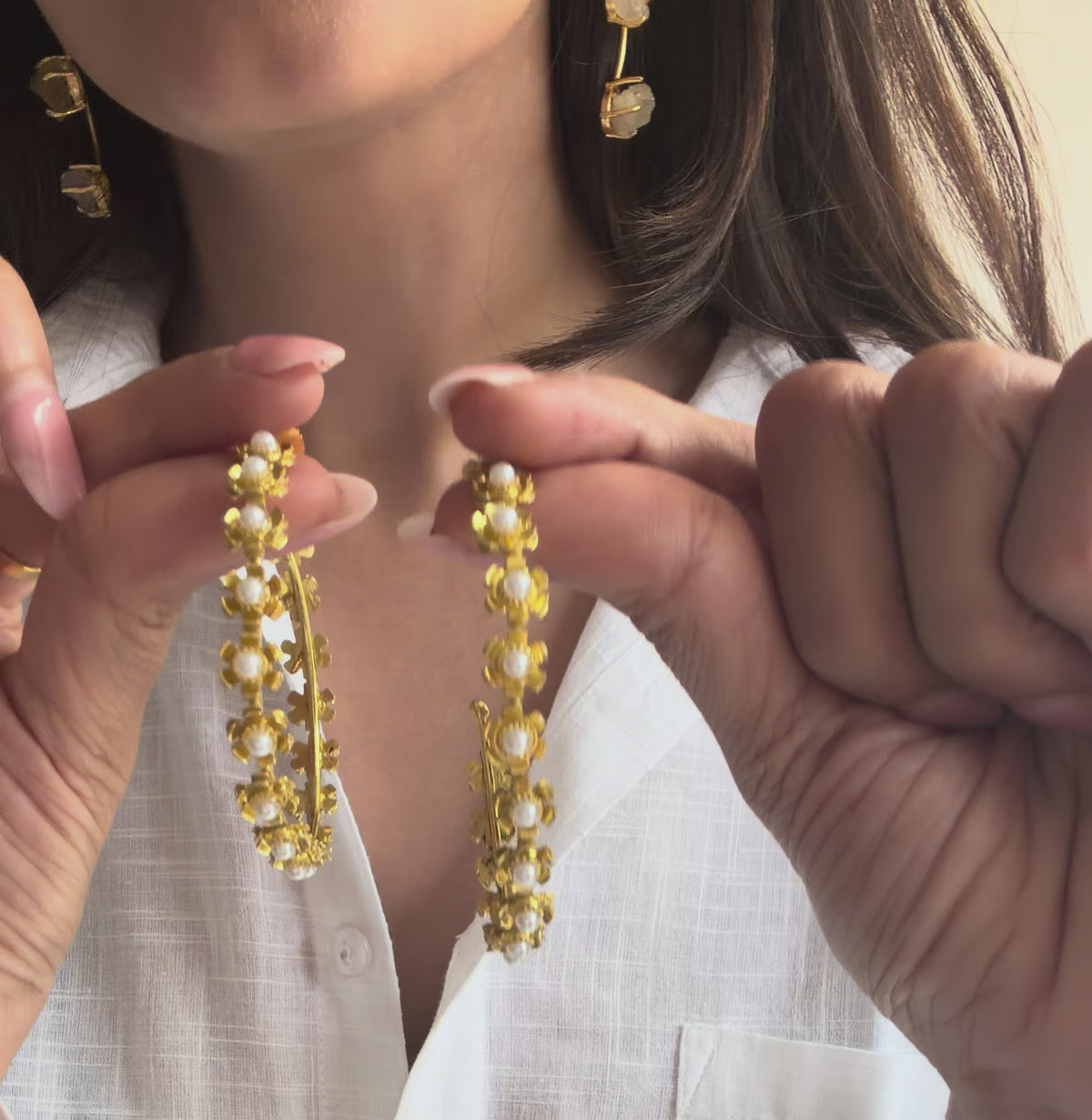 video of model showing the phool hoops and ots details