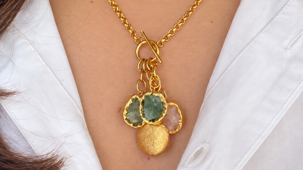 Latkan Stone Necklace with dangling pink and green stones and a round gold-finish charm