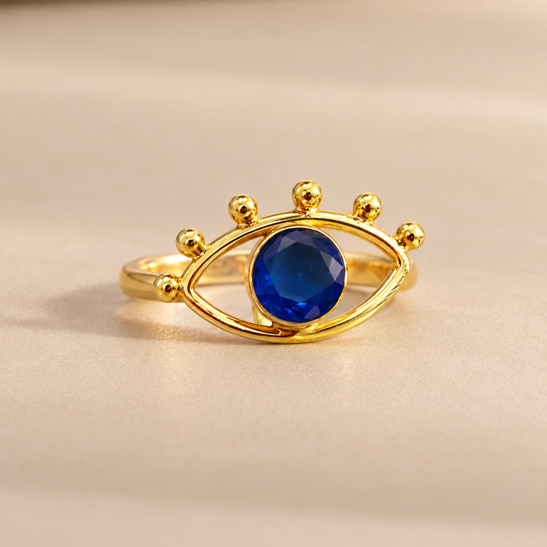 Front view of the Nazar Ring showing an open gold eye outline and six gold bead accents