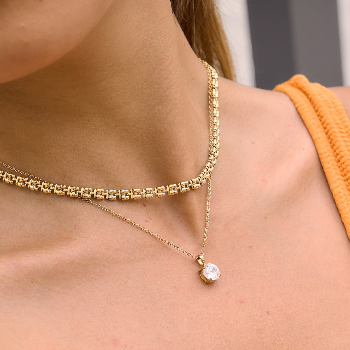 Zar anecklace paired with an everyday diamond necklace for a mordern look